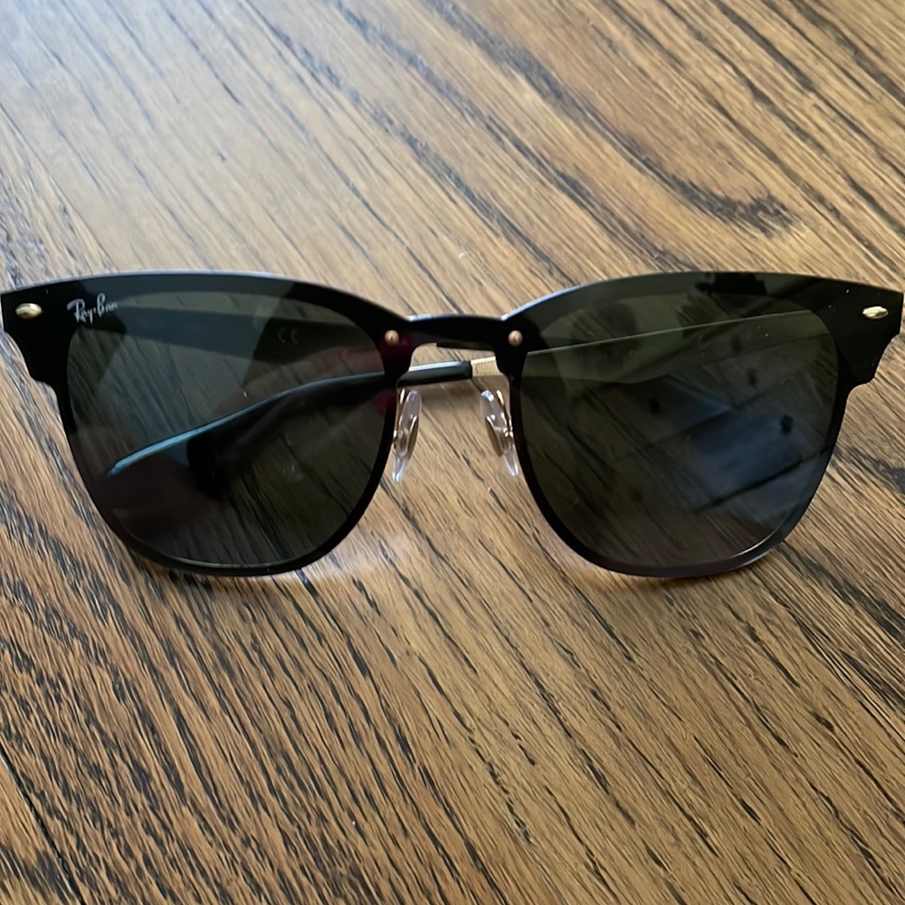 Black and gold Ray Bans